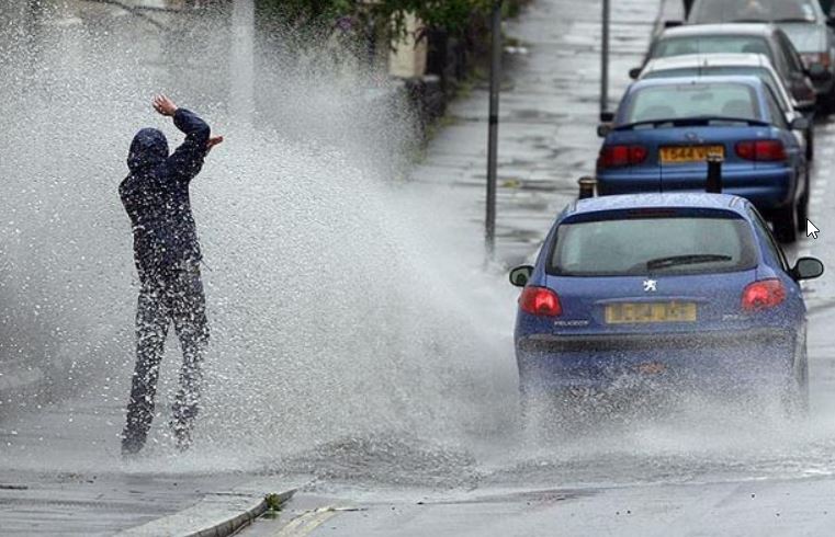 car splashing pedestrian