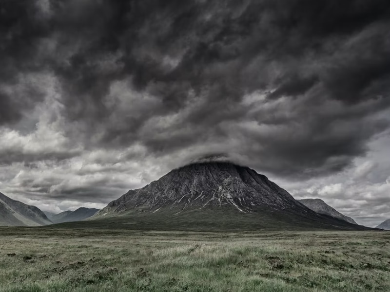 dark clouds above mountain