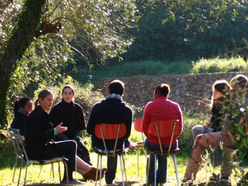 group of people talking outside