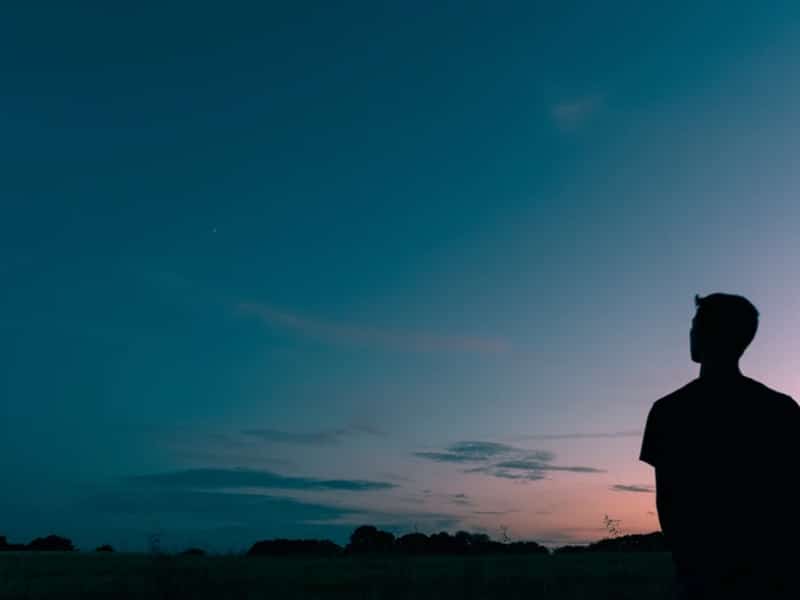 man alone outside sky