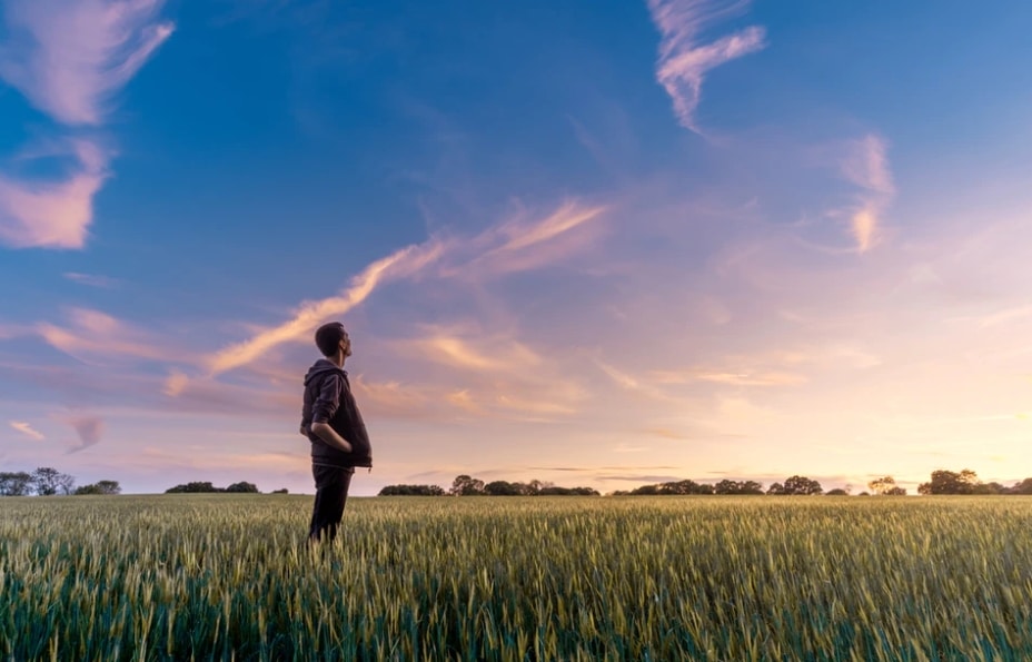 man standing in field