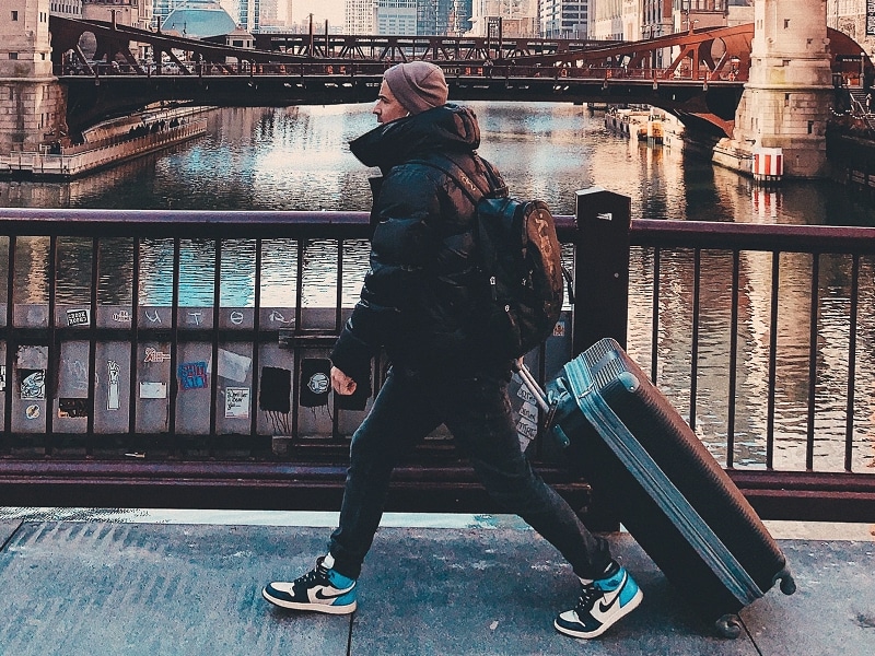 man walking with baggage