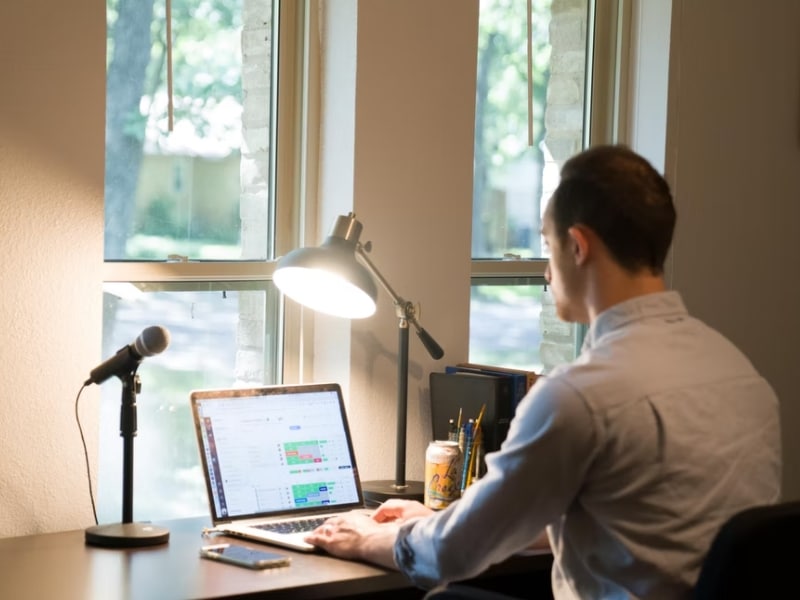 man working on laptop at desk