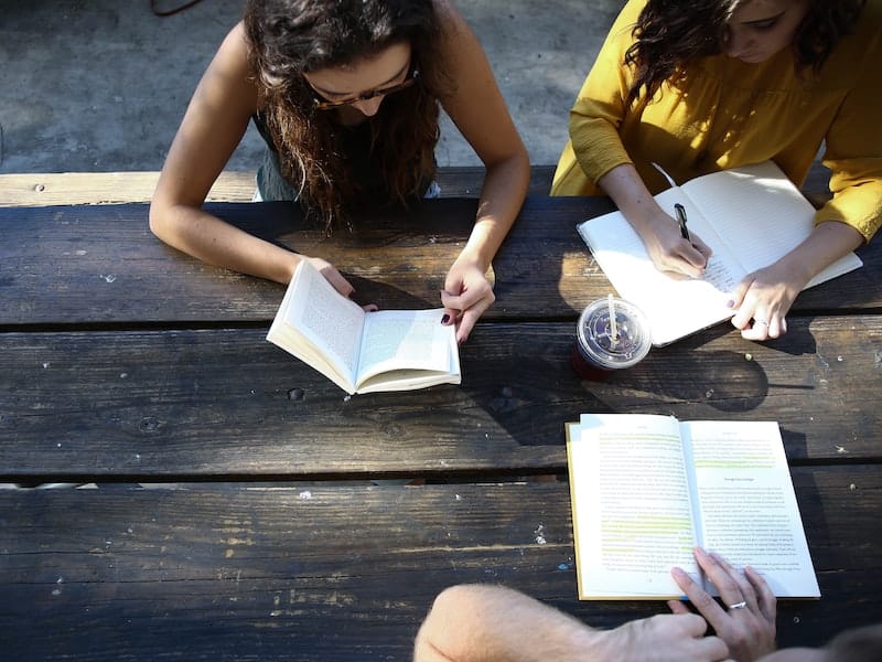 people studying and reading books