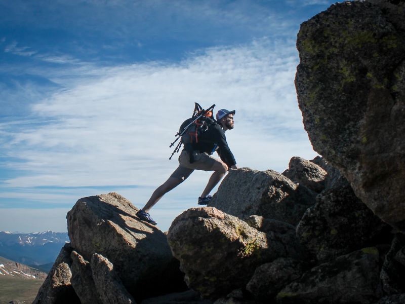 person climbing a mountain