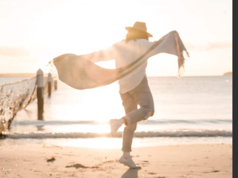 person dancing on beach