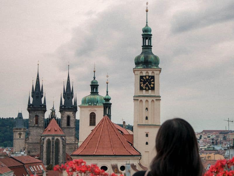 person looking at clock tower