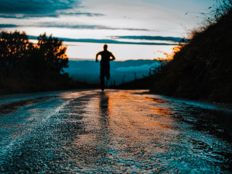 person running on wet street