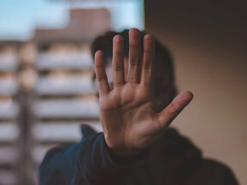 person showing hand stop sign