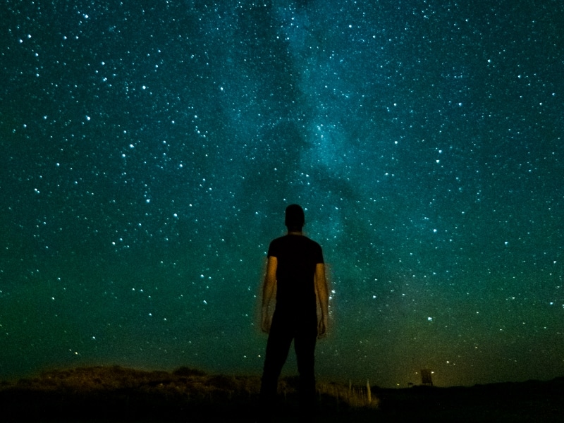 person underneath milky way stars