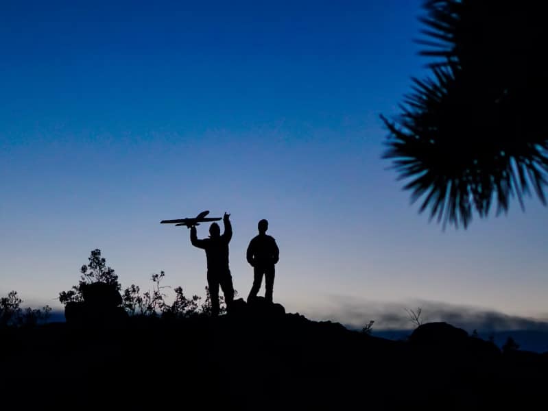 two persons outside at night