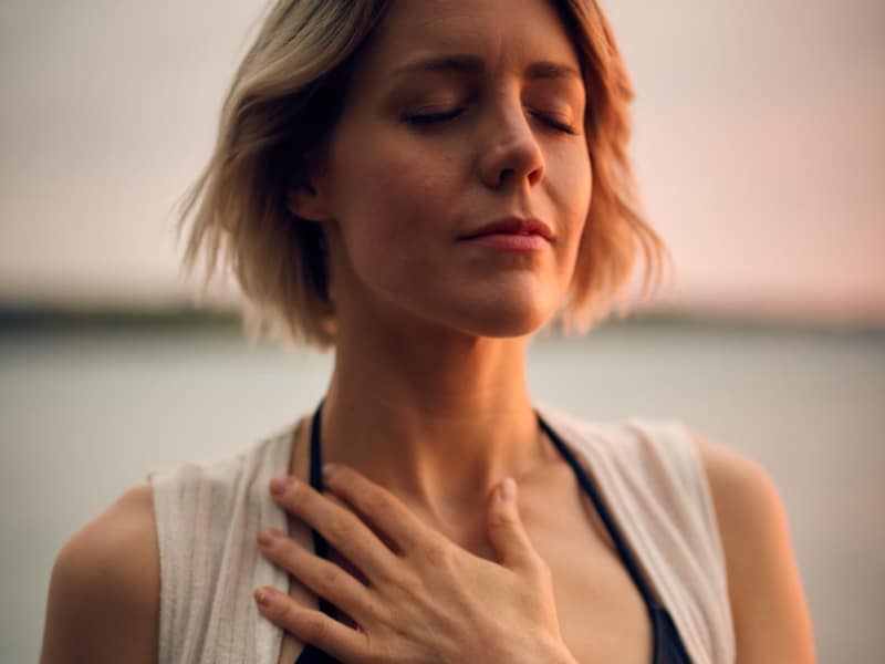 woman closed eyes breathing