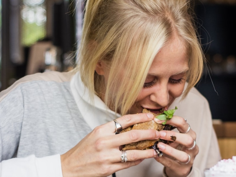 woman eating burger