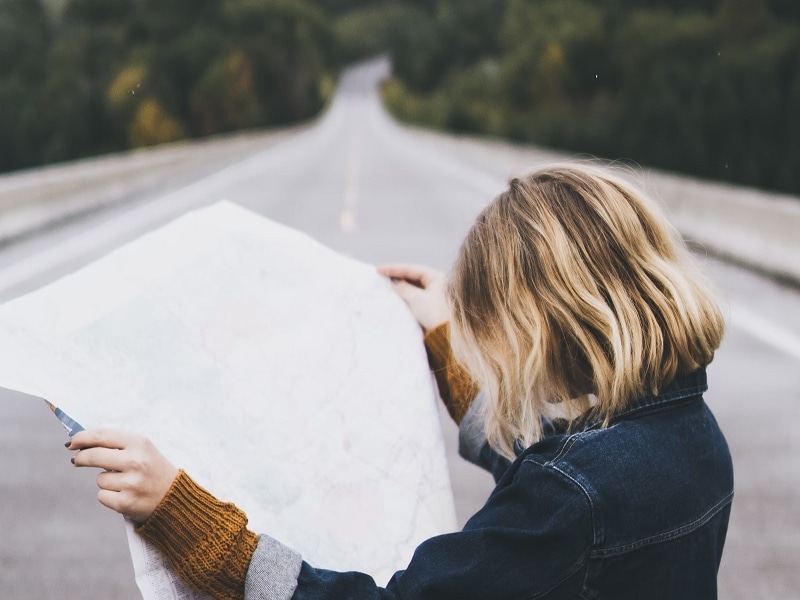 woman looking on map for directions