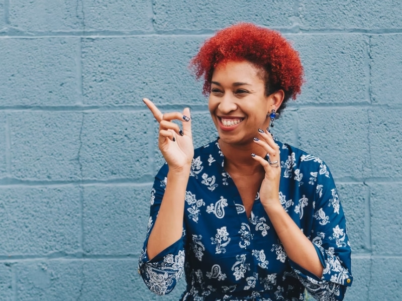 woman smiling blue background