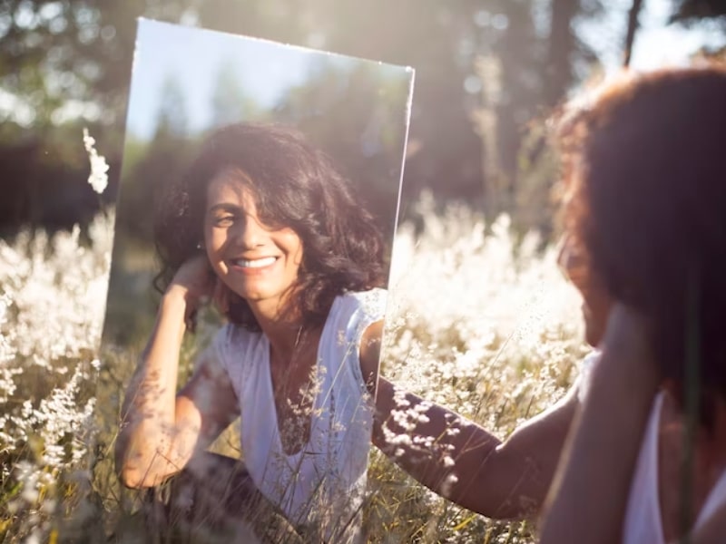 woman smiling in mirror