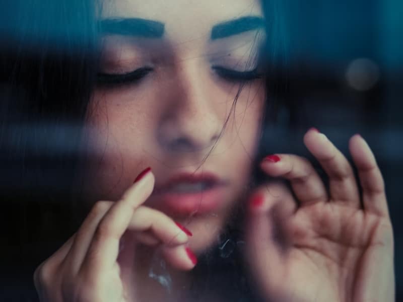 woman with closed eyes focused