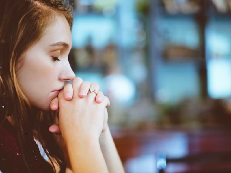 woman with closed eyes thinking