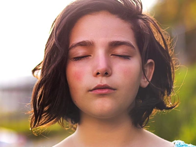 woman with eyes closed emptying mind